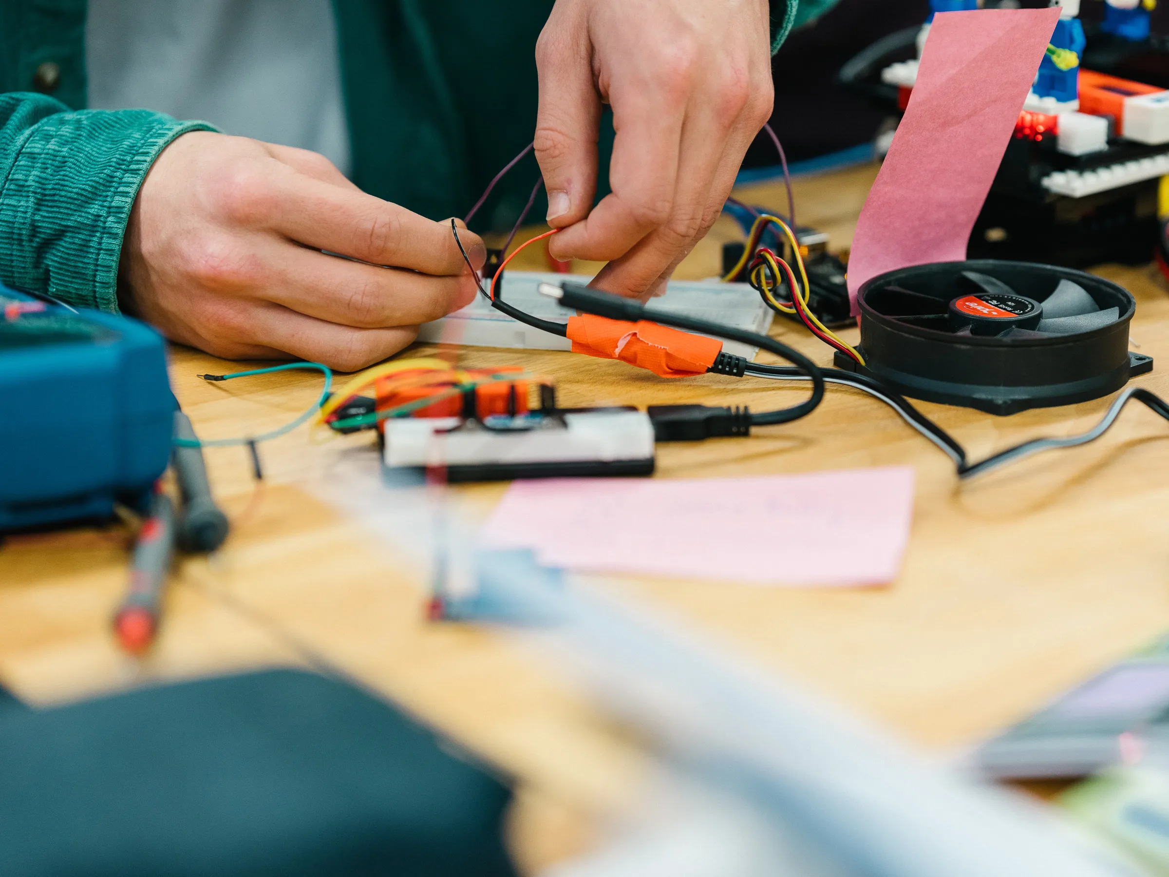 Technical setting of the workshop: ready-made sensing and acting modules and the online platform used for machine learning